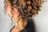 24 a curly updo with a curly top and some curls down to make it look more effortless is a chic idea