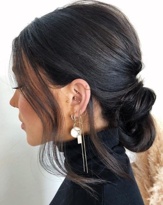 a low knot with a bump on top and some hair framing the face is a catchy and lovely idea for everyone