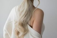 41 a beautiful wavy low ponytail with a braided wrap and some locks down is a chic idea for a girlish look