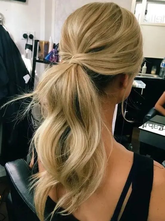 a simple and cute low ponytail with waves, locks down and a bump on top is always a good and quick to make hairstyle