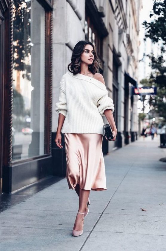 a blush slip dress, an oversized white one shoulder sweater, blush shoes and a clutch for a party