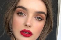a classy Christmas makeup with a red lip, matte tone with blush, accented eyes is amazing