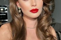 a fantastic holiday wedding makeup with a red lip, a touch of blush, wings and extended eyelashes, lovely eyebrows is wow