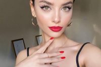 a fresh holiday wedding makeup with a red lip, a touch of blush, lash extensions and wings is ideal for both a party and a wedding