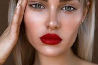 a lovely red lip makeup with a bold red lip as the maina ccent, a touch of blush, fluffy eyebrows and lined up eyes