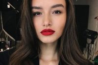 a perfect red lip makeup with a bold red lip, a touch of blush, fluffy eyebrows and a perfect skin tone for the wedding