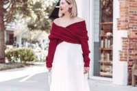 a timeless girlish look with a burgundy wrap off the shoulder sweater, a white pleated midi skirt, silver shoes and a statement earrings