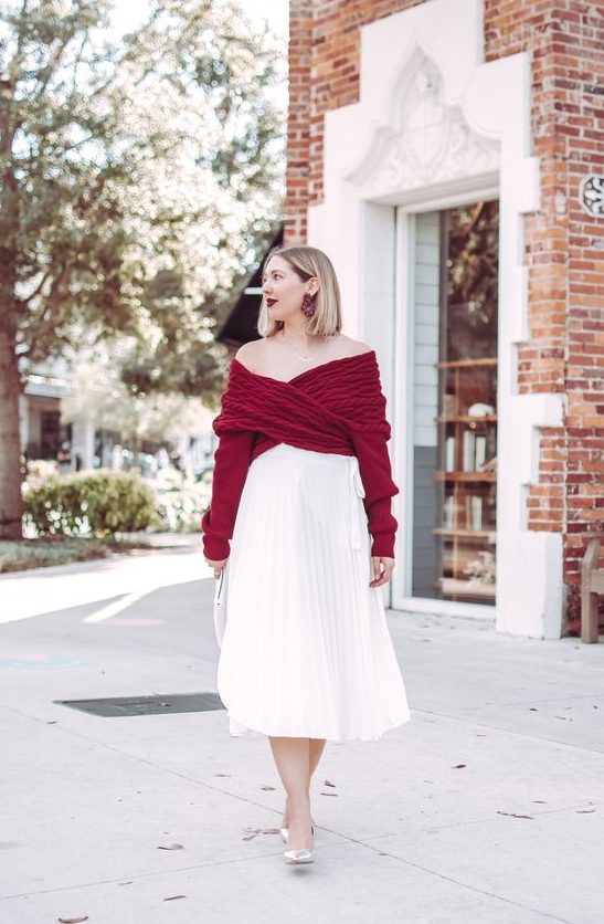 a timeless girlish look with a burgundy wrap off the shoulder sweater, a white pleated midi skirt, silver shoes and a statement earrings