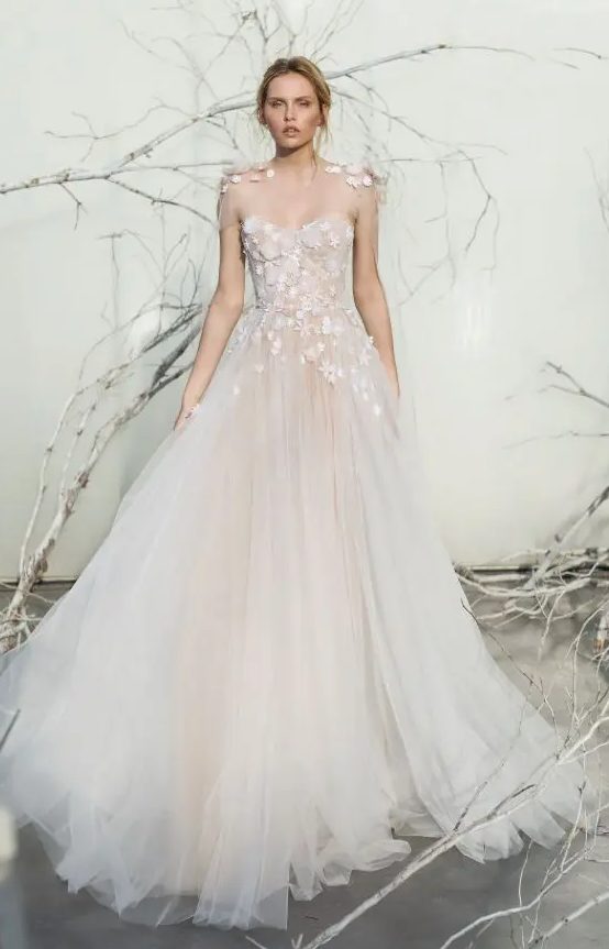 blush tulle ballgown with an illusion bodice and white floral appliques on the shoulders and bodice