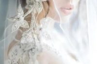04 a sheer veil adorned with silver flower applique and crystals is a very sophisticated and beautiful idea