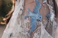 06 a beautiful embroidered and embellished wedding veil with crystals, sequins and blue birds is amazing for a wedding