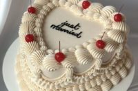 09 a Just Married heart-shaped lambeth wedding cake with cherries is a super trendy idea for a wedding