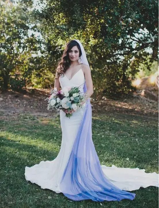 a modern plain mermaid wedding dress with spaghetti straps and an ombre white blue veil for a bold look