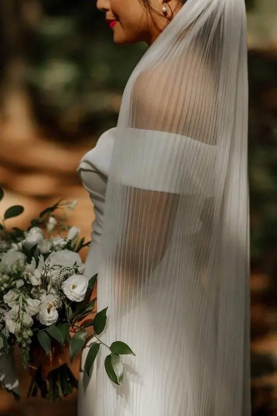 a pleated wedding veil is a bold and edgy solution for a modern bride, it's really an out of the box idea