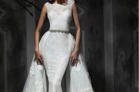12 a sheath lace wedding dress with cap sleeves and a lace overskirt, an embellished belt