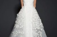 13 a floral lace applique sheath wedding dress with an additional tulle overskirt for the ceremony