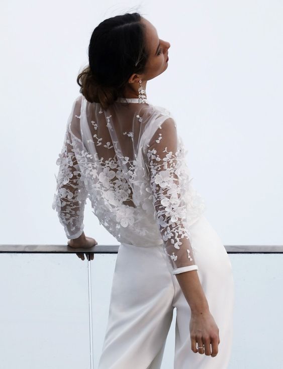 a sheer bridal cover up with white floral lace applique is a stylish and chic solution