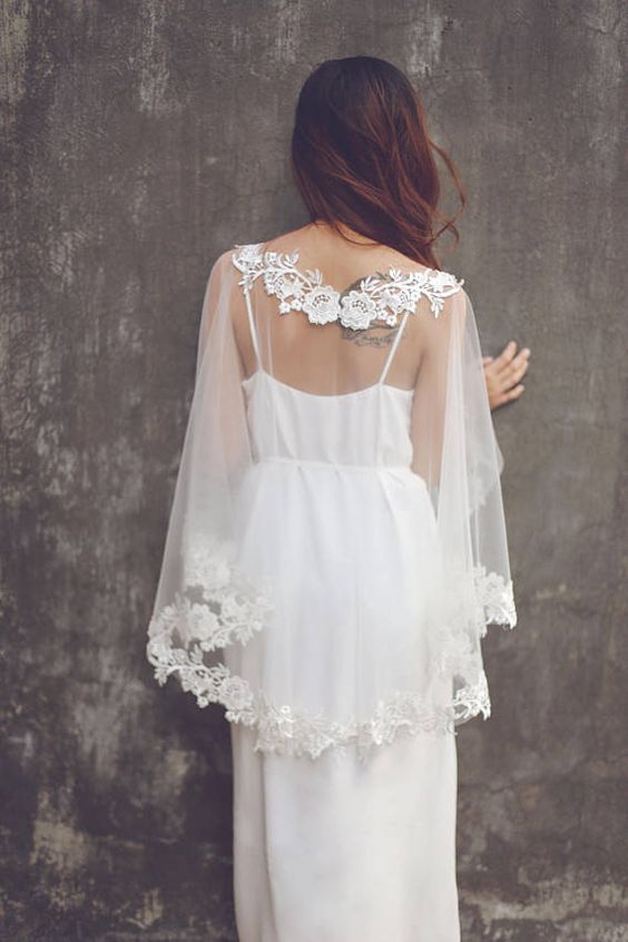 a clear cover up with floral lace applique is a very refined and chic accessory for a delicate bridal outfit