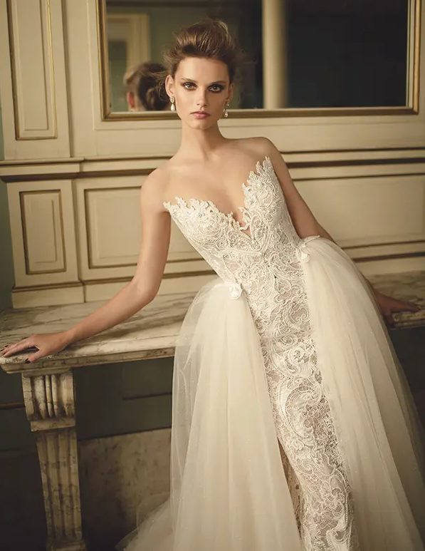 a strapless lace sheath wedding dress of lace and a tulle overskirt - looks refined and gorgeous
