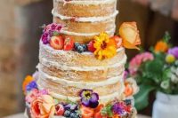 16 a colorful naked wedding cake topped with bright blooms and berries is a fantastic idea for a summer boho wedding with plenty of color