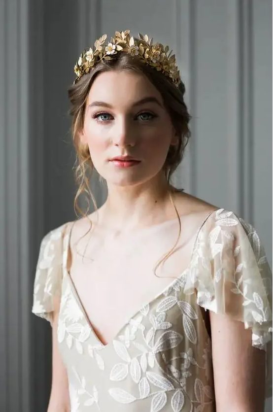 a delicate flower and leaf gold tiara is a beautiful idea for a wedding, it can be worn with many dresses and rocked in many styles