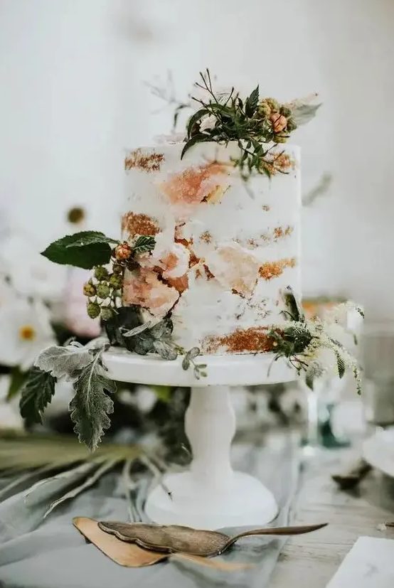 a naked cake with fresh herbs, berries and sugar geodes that are a cool wedding trend