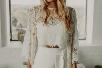 21 a beautiful boho bridal look with a plain crop top and a lace long sleeve one over it, plain high waisted pants, a white hat