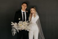 23 a white pantsuit with cropped pants and a blazer, tan shoes and a long embellished veil for a modern bride