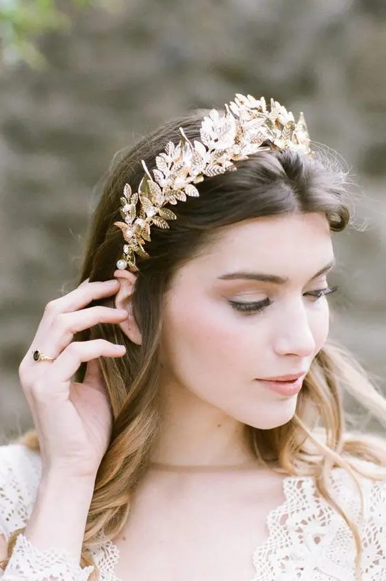 a gold leaf bridal tiara is a pretty statement-like headpiece that can add a glam feel to the look