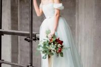 28 a light blue off the shoulder A-line wedding dress with an embellished belt and a full skirt