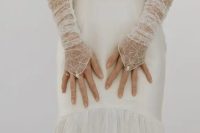 28 sheer fingerless embroidered wedding gloves with floral patterns and pearls are amazing as an accessory for this wedding look