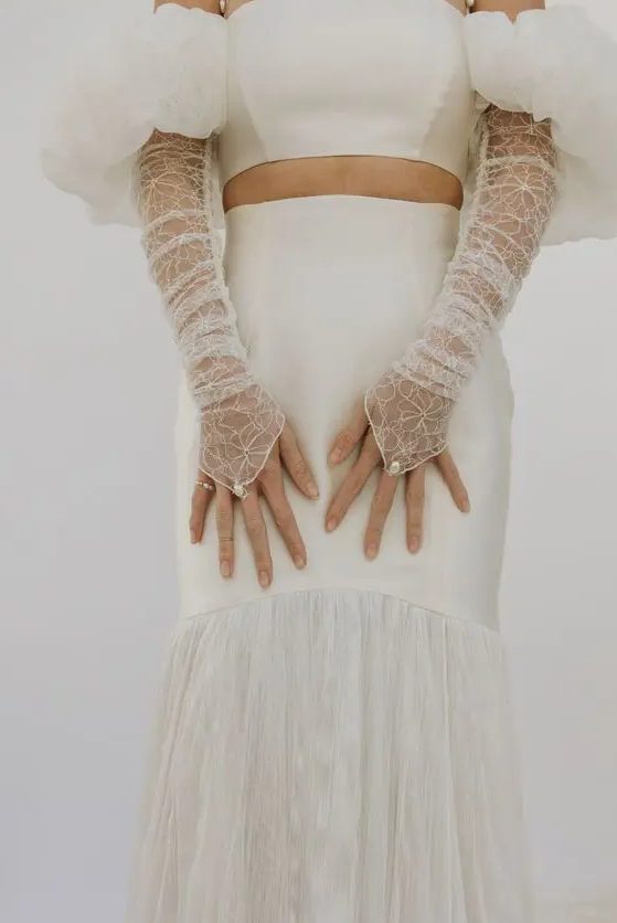 sheer fingerless embroidered wedding gloves with floral patterns and pearls are amazing as an accessory for this wedding look