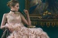29 a sophisticated bridal look with a dusty pink wedding dress with a draped bodice and a V-neckline, a ruffle skirt, floral print lace up boots and a black choker