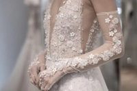 31 an A-line embellished lace applique wedding dress paired with matching long gloves are a gorgeous and trendy combo for a bride