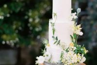 32 a chic secret garden wedding cake in white, with fresh white and yellow blooms and greenery is a lovely idea for a relaxed garden wedding