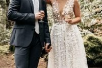 33 a gorgeous lace applique midi wedding dress with a plunging neckline and no sleeves plus nude shoes