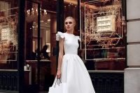 36 a modern midi wedding dress with ruffled cap sleeves and a full skirt plus nude heeled sandals