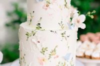 36 a neutral wedding cake decorated with pastel flowers and butterflies of sugar is amazing for a spring wedding