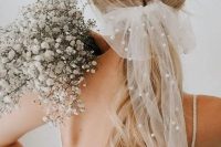42 a beautiful sheer bow with pearls is a very trendy bridal accessory and a fresh way to wear pearls on your wedding day