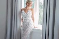 45 a jaw-dropping feather embellished wedding dress with a sweetheart neckline and a train is amazing for an art deco bride