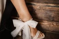 48 gorgeous shiny white block heels with tulle bows are an amazing addition to your chic modern bridal look