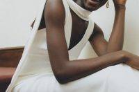 53 a minimalist bridal look with a plain wedding dress and a matching scarf, a tiara and statement earrings