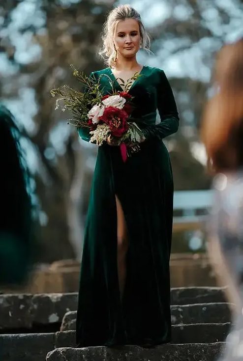 a green velvet A-line dress with a deep neckline, long sleeves, a front slit is a gorgeous solution for a modern fall bride
