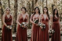 chic mismatching rust-colored velvet bridesmaid dresses with deep necklines will fit both a fall and a winter wedding