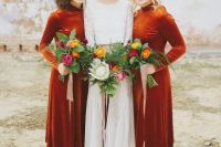 creative rust-colored midi bridesmaid dresses with long sleeves and turtlenecks and silver shoes for a boho fall wedding
