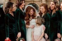 emerald velvet fitting maxi bridesmaid dresses with long sleeves and V-necklines to keep the girls warm