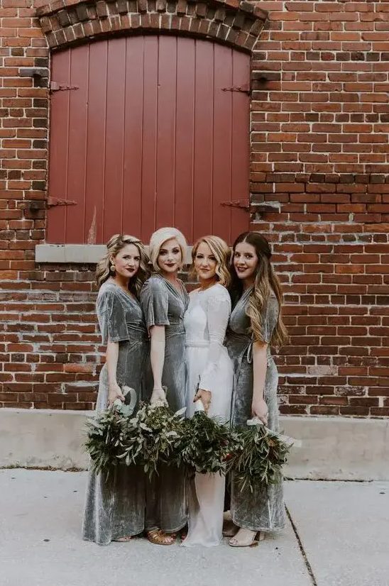 grey velvet maxi bridesmaid dresses with short sleeves and nude shoes for a chic winter wedding