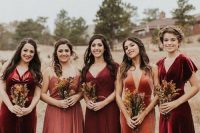 lovely mismatching burgundy, burnt orange and coral velvet and not only bridesmaid dresses for a fall boho wedding