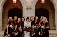 matching burgundy velvet maxi bridesmaid dresses with V-necklines and short sleeves for a winter wedding