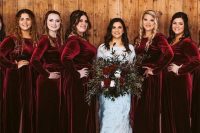 matching burgundy velvet maxi bridesmaid dresses with high necklines and long sleeves are great for a winter wedding